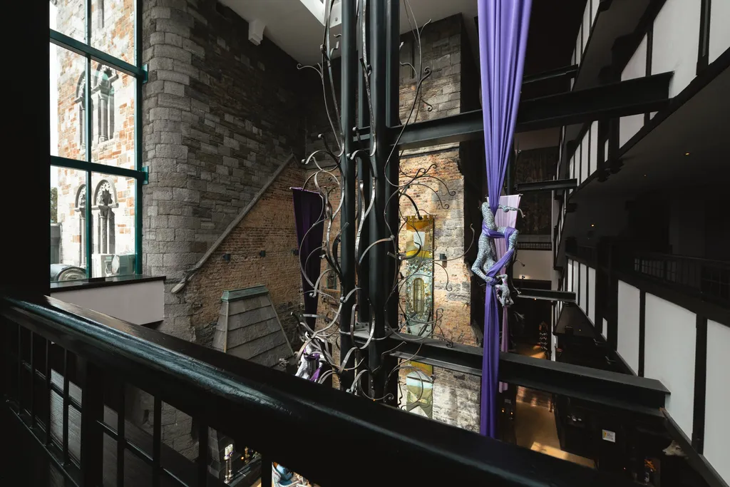 The atrium’s wrought-iron sculpture seen from the upper gallery